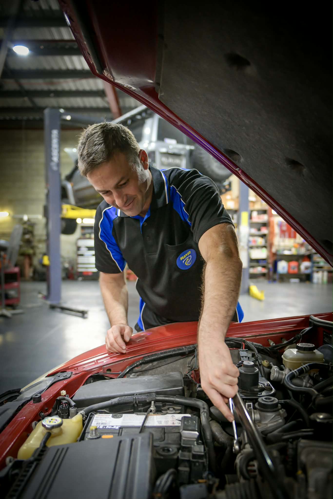 mechanic working on vehicle