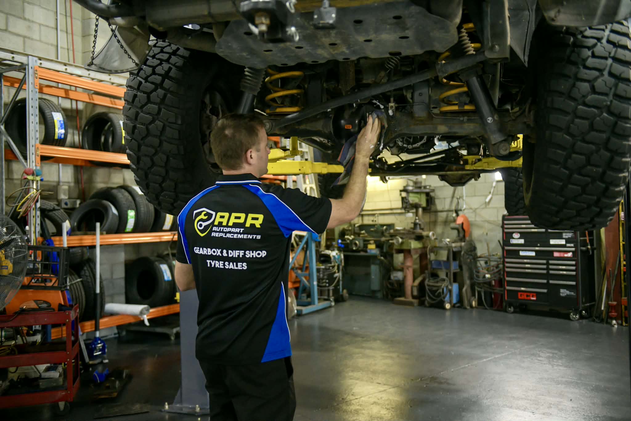 mechanic working on vehicle