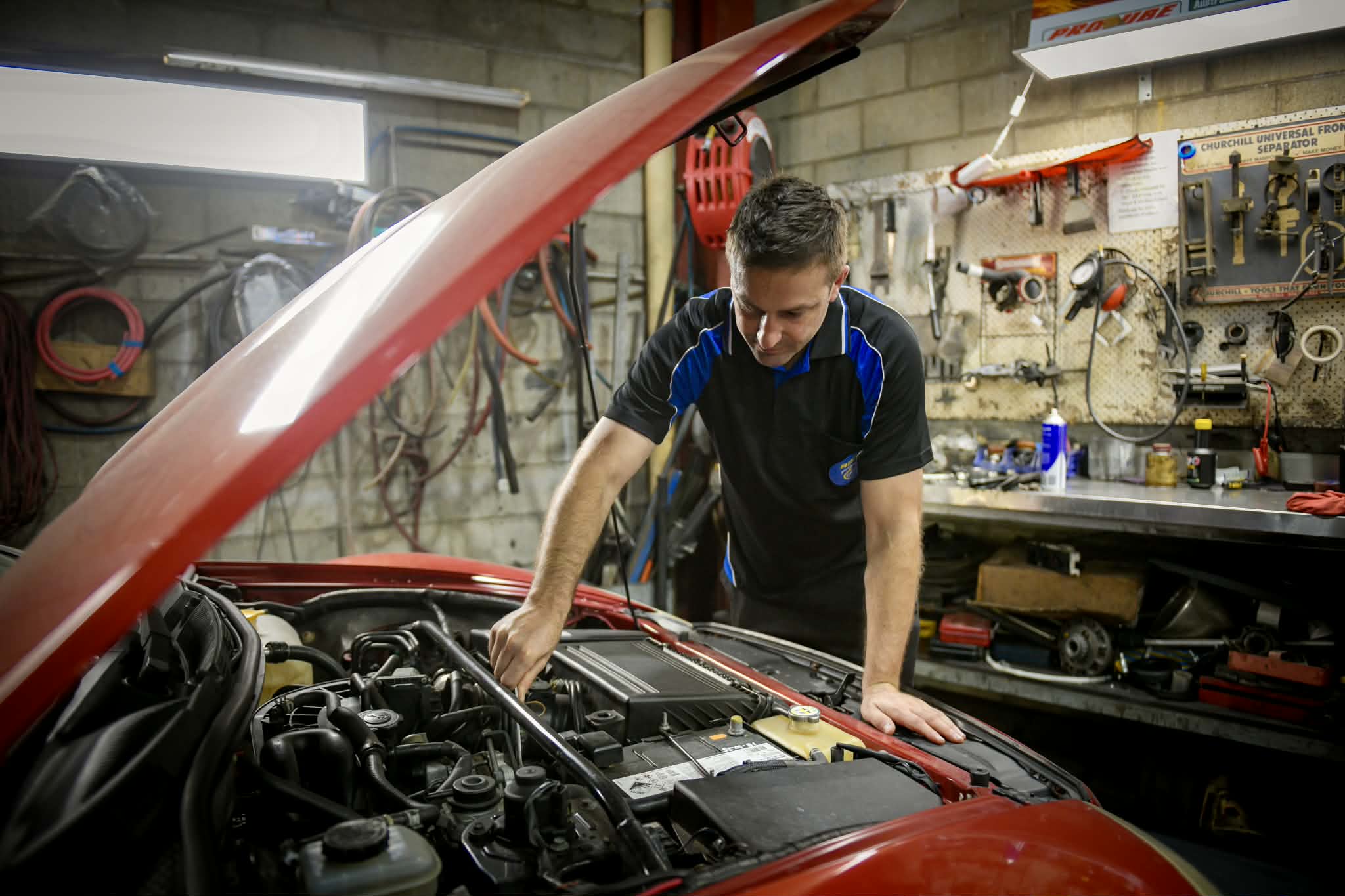APR mechanic working on a car in the workshop